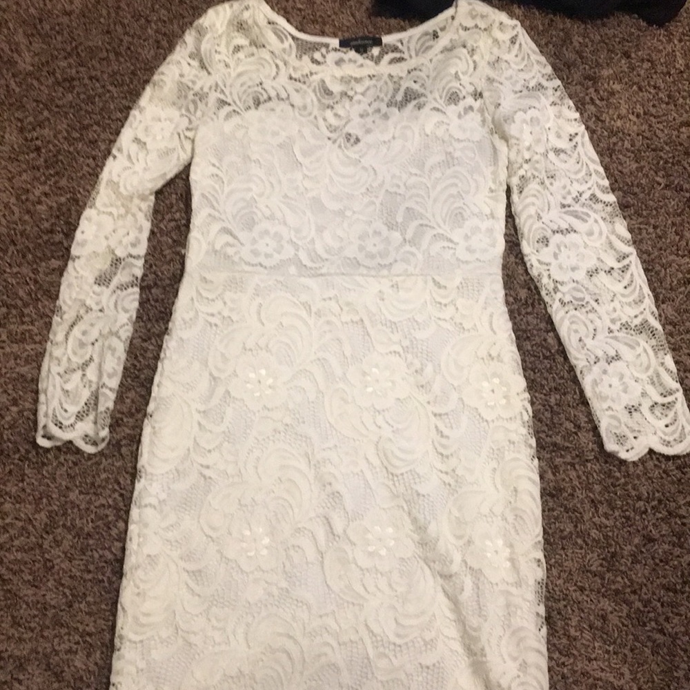 White lace dress goes to mid thigh. Fits like a 3